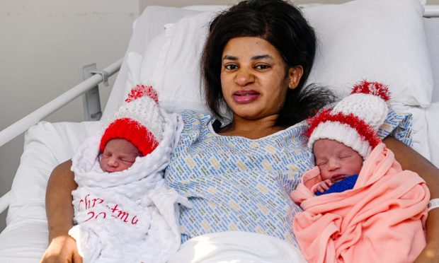 the babies are pictured with mum Mercy Simons