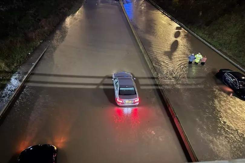 Police rescue two people from a car on the A555